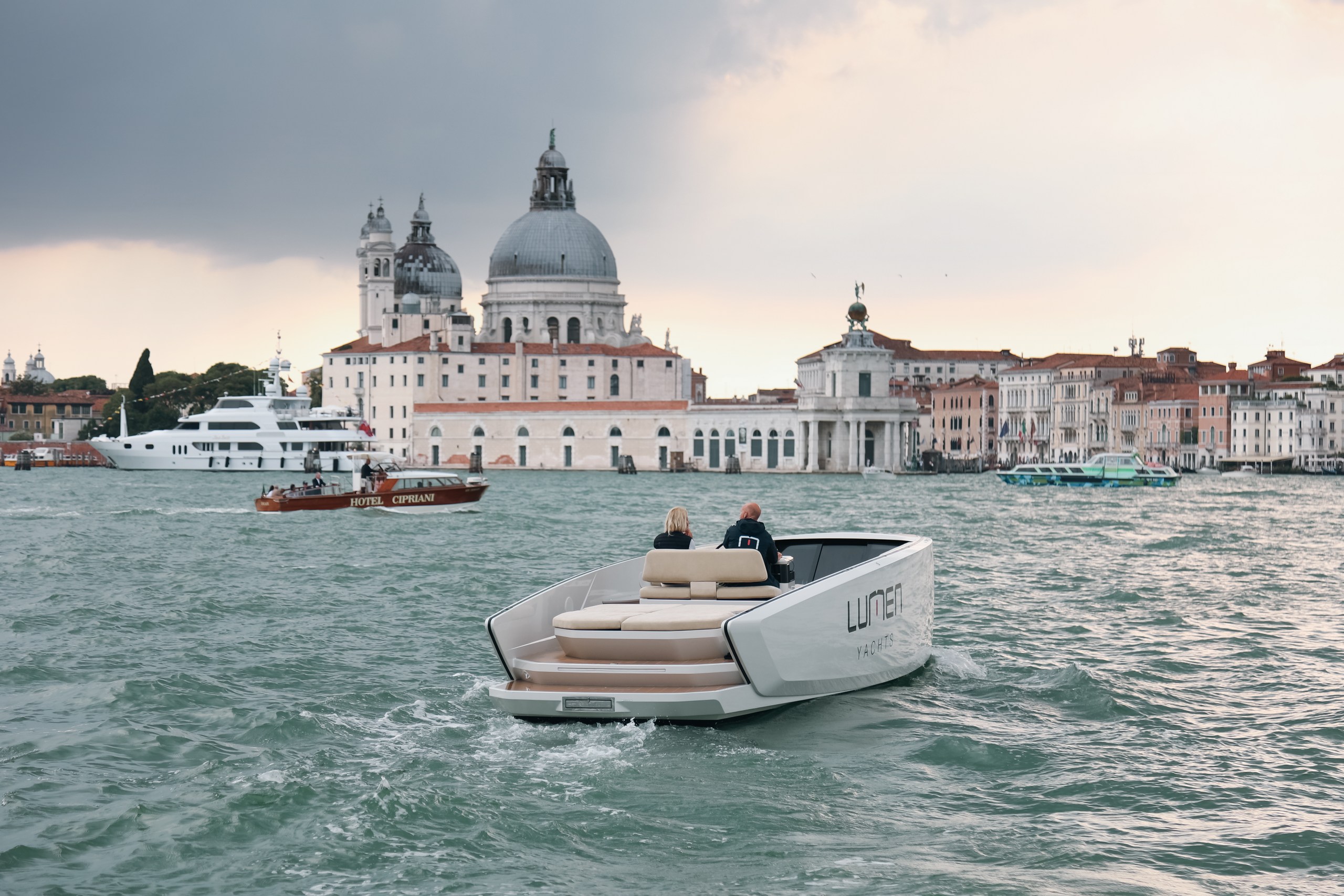 Lumen E10 electric boat on calm water — premium electric boat price and value